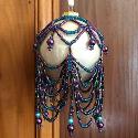 Purple and turquoise beaded bauble cover.