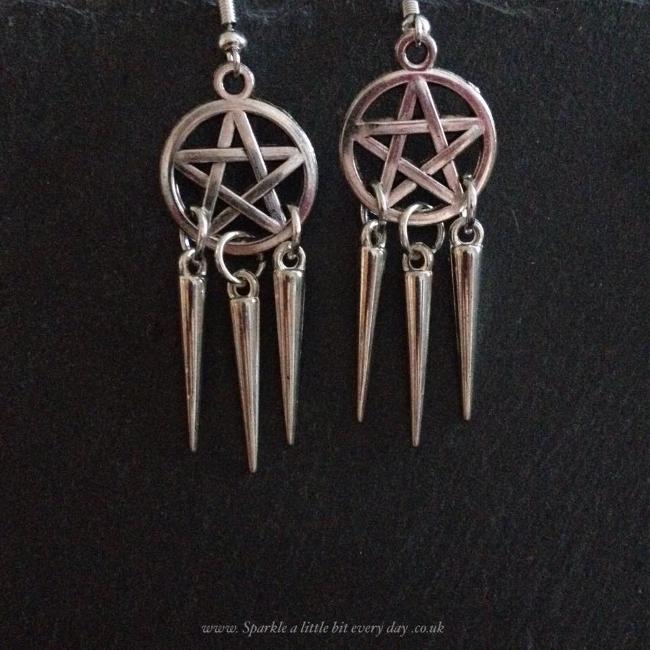 Pentagram dreamcatcher earrings.