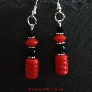 Red drop earrings.