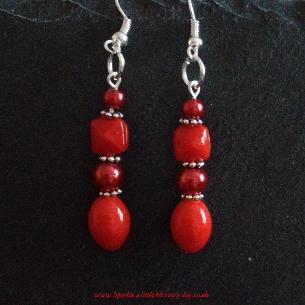 Red drop earrings.