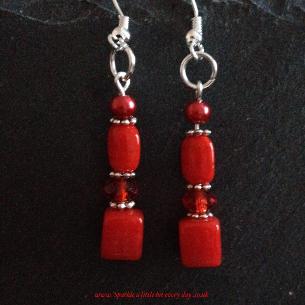 Red drop earrings.