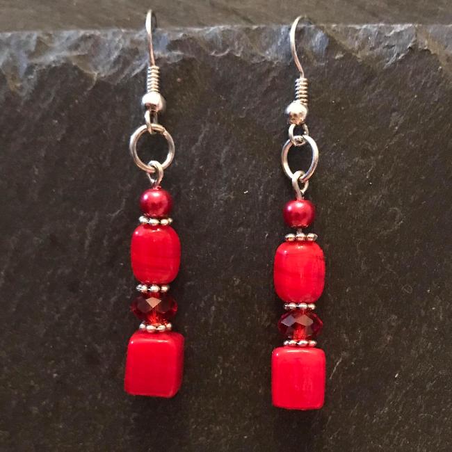 Red earrings made from glass beads and crystals.