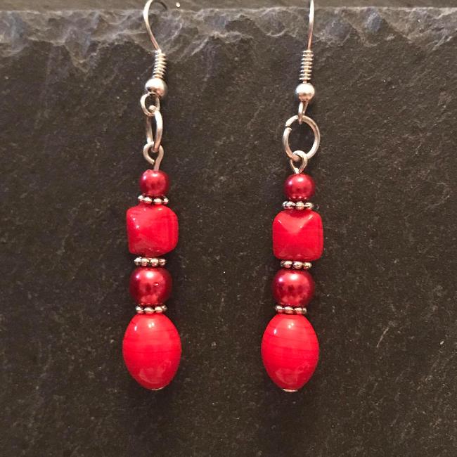 Red earrings made from glass beads and crystals.