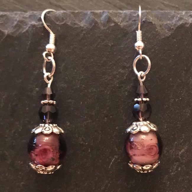 Purple earrings made from glass beads and crystals.