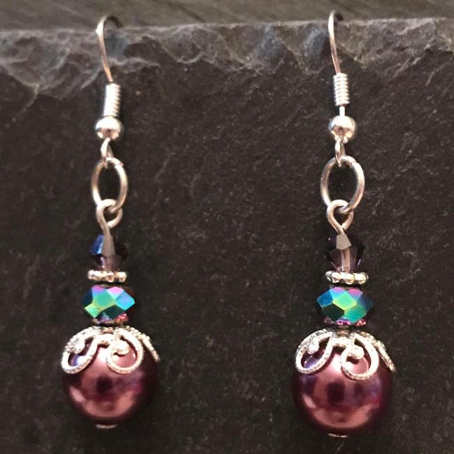 Purple earrings made from glass beads and crystals.