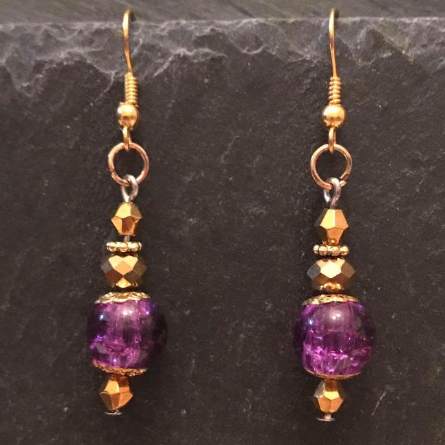 Purple earrings made from glass beads and crystals.