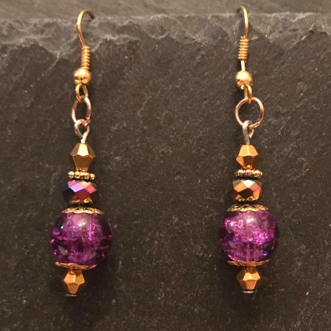 Purple earrings made from glass beads and crystals.