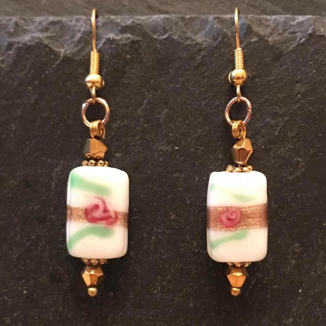 Gold earrings made from glass beads and crystals.