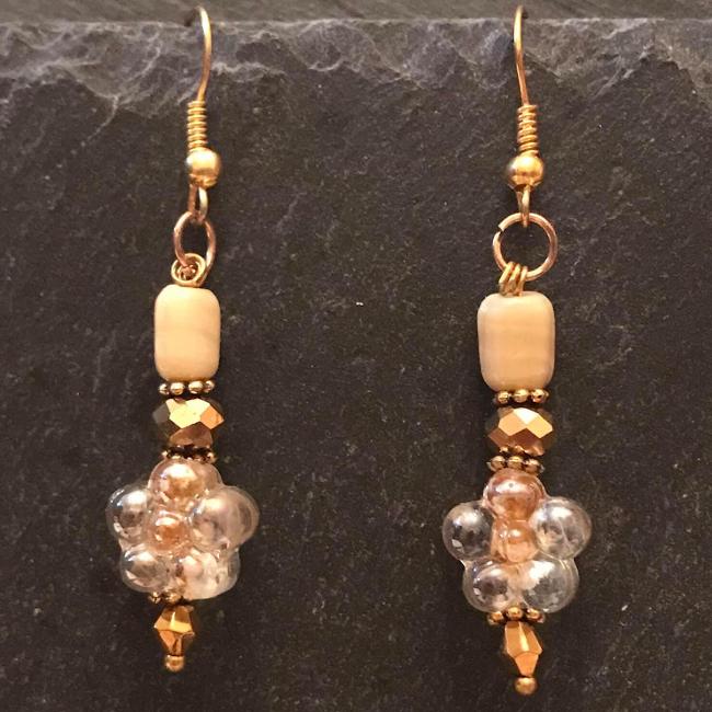 Gold earrings made from glass beads and crystals.