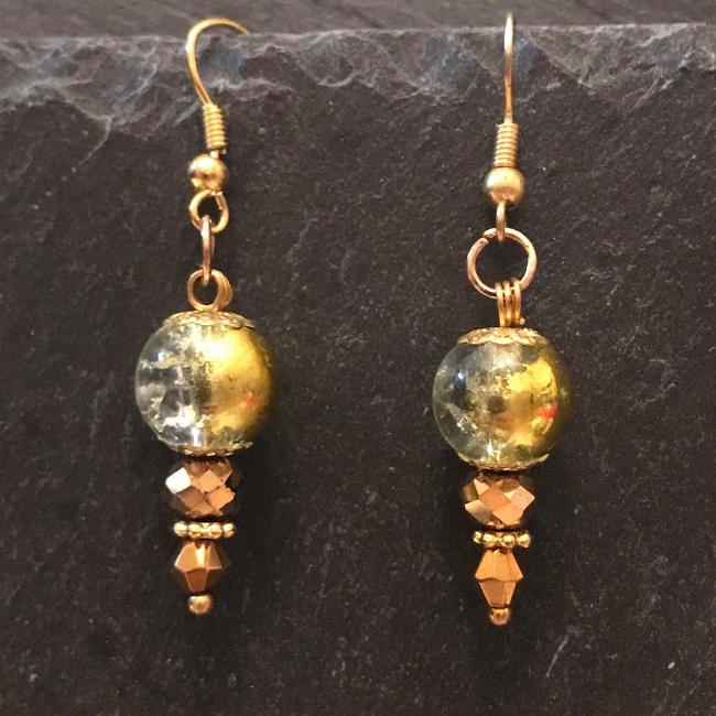 Gold earrings made from glass beads and crystals.