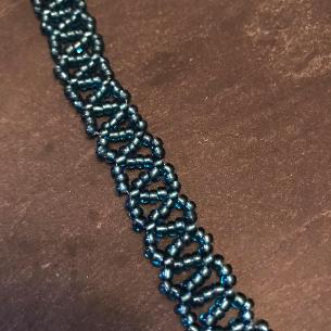 Turquoise pearl necklace. Close up photo of side strap.