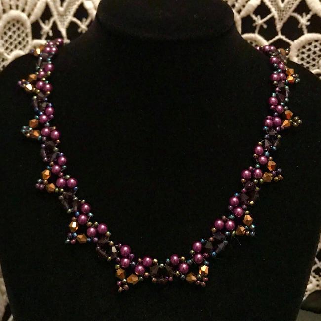 Purple and gold necklace.