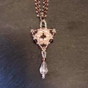 Tudor triangle pendant.