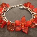 Red flowers bracelet. The lucite flowers make this bracelet a substantial size yet lightweight.