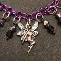Close up of purple and silver fairy bracelet.
