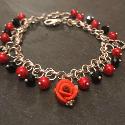 Rose and Hearts bracelet. Polymer clay rose with silvertone metal hearts and glass pearls and crystals.