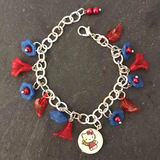 Red and blue flowers kitty child's bracelet.