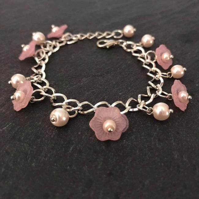 Pink flowers and pearls child's bracelet.