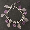 Purple flowers and white leaves child's bracelet.