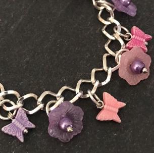 Pink and purple butterflies and flowers child's bracelet.