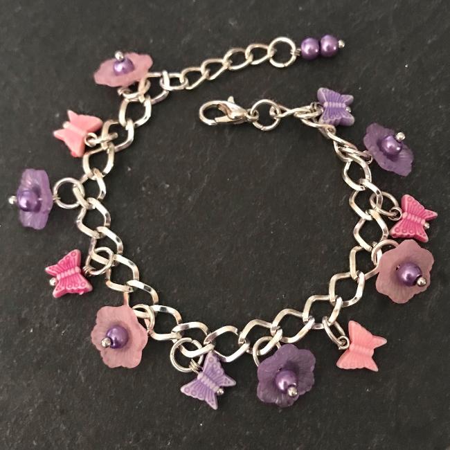Pink and purple butterflies and flowers child's bracelet.