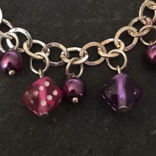 Close up view of dice on the bracelet..