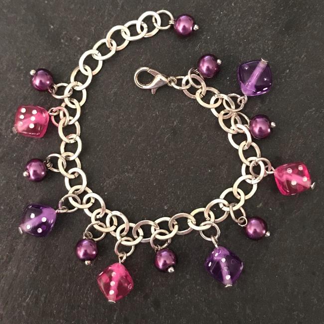 Pink and purple dice child's bracelet.