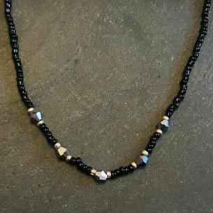 Black seed bead and silver crystal necklace.