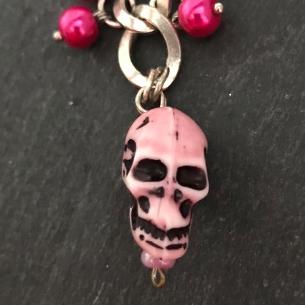 Close up view of a feature of the bag charm.