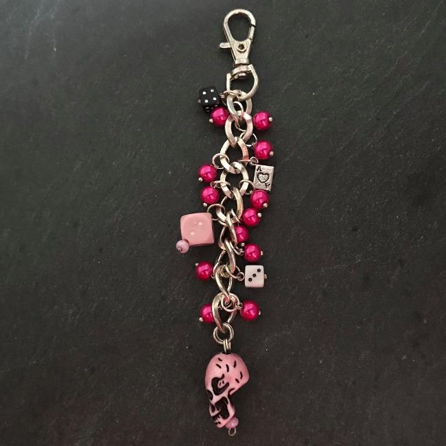 This fun bag charm can clip easily onto your bag, your coat, or anywhere you like.