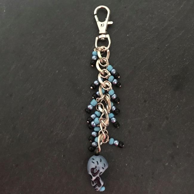 This fun bag charm can clip easily onto your bag, your coat, or anywhere you like. 