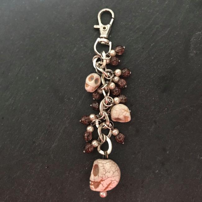 This fun bag charm can clip easily onto your bag, your coat, or anywhere you like.