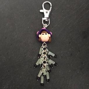 Mary with purple crystals bag charm.