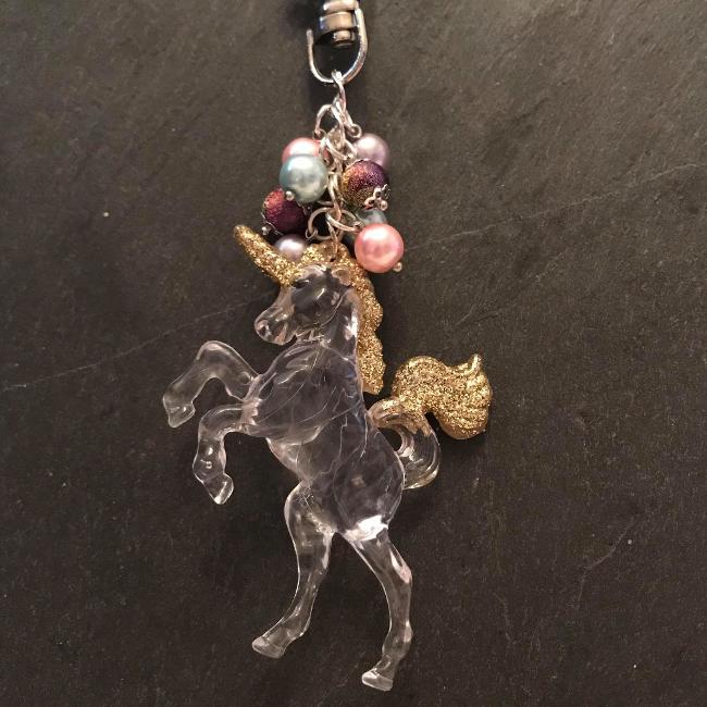 This fun bag charm can clip easily onto your bag, your coat, or anywhere you like.