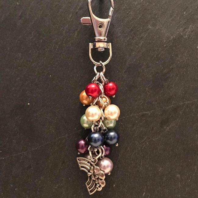 This fun bag charm can clip easily onto your bag, your coat, or anywhere you like. 