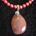 Pink agate pendant with deep pink pearls.
